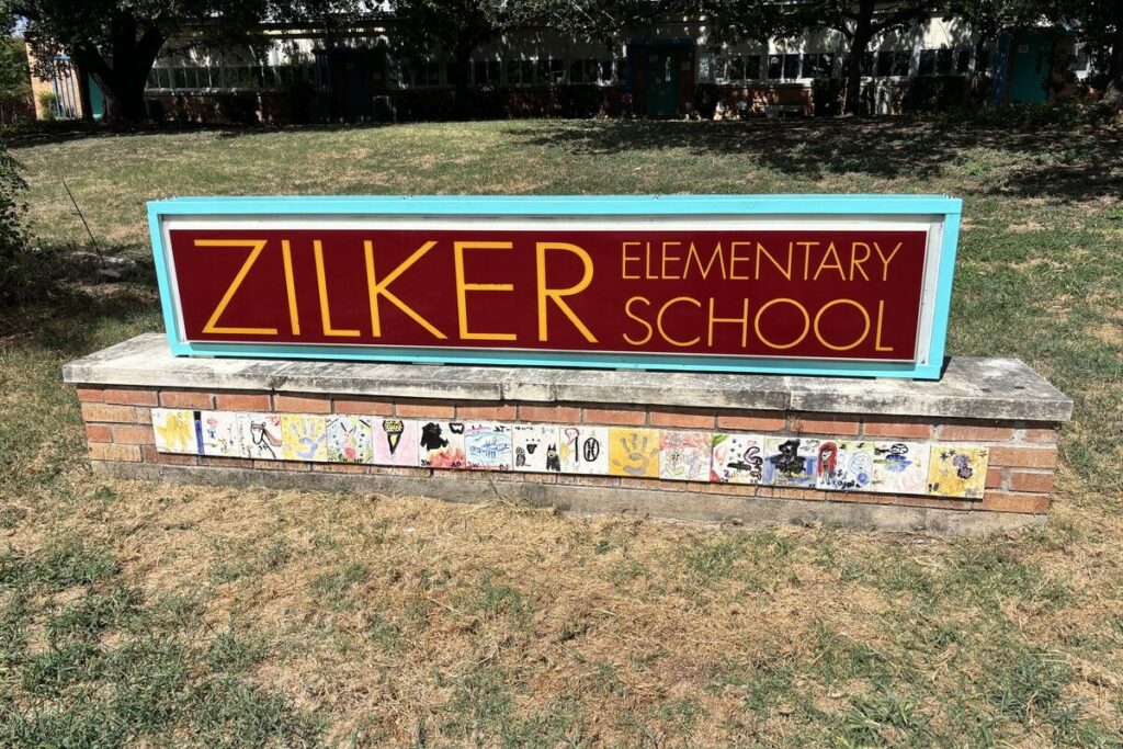 Zilker Elementary School sign on the front lawn of the campus